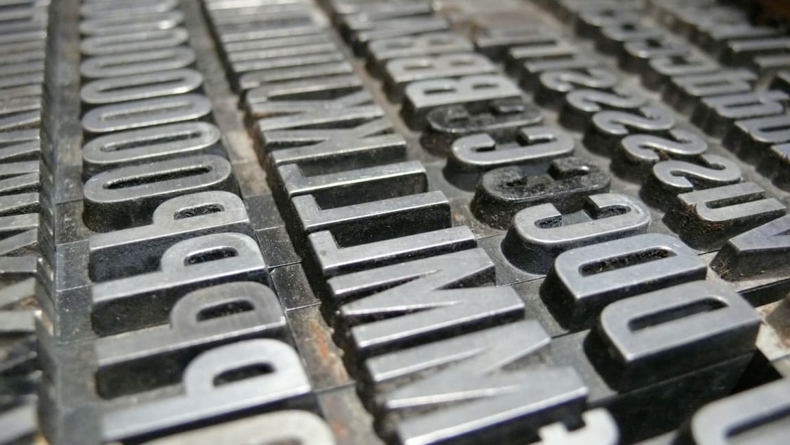 image of metal type font