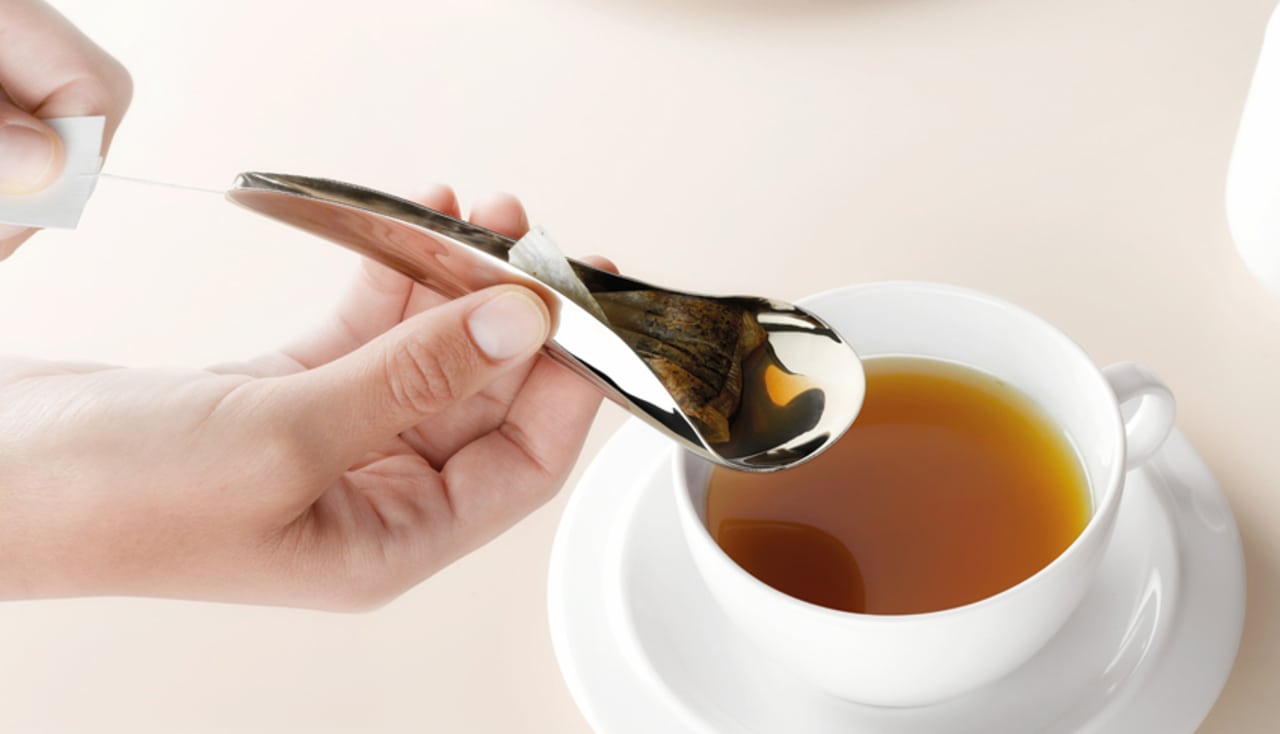 Spilled Tea with Spoon and Tea Bag