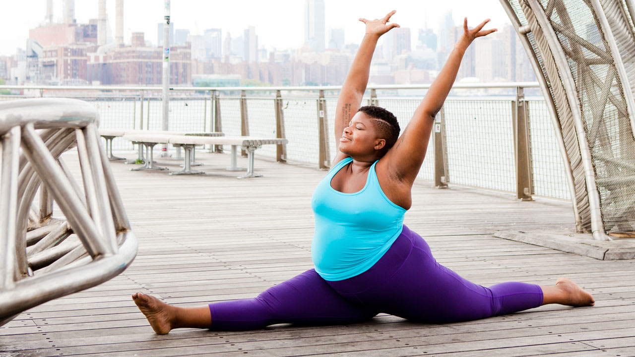 Premium Photo  Attractive woman in black sportswear practicing yoga is  engaged in meditation in the lotus position on a gymnastic mat in the studio  near the window