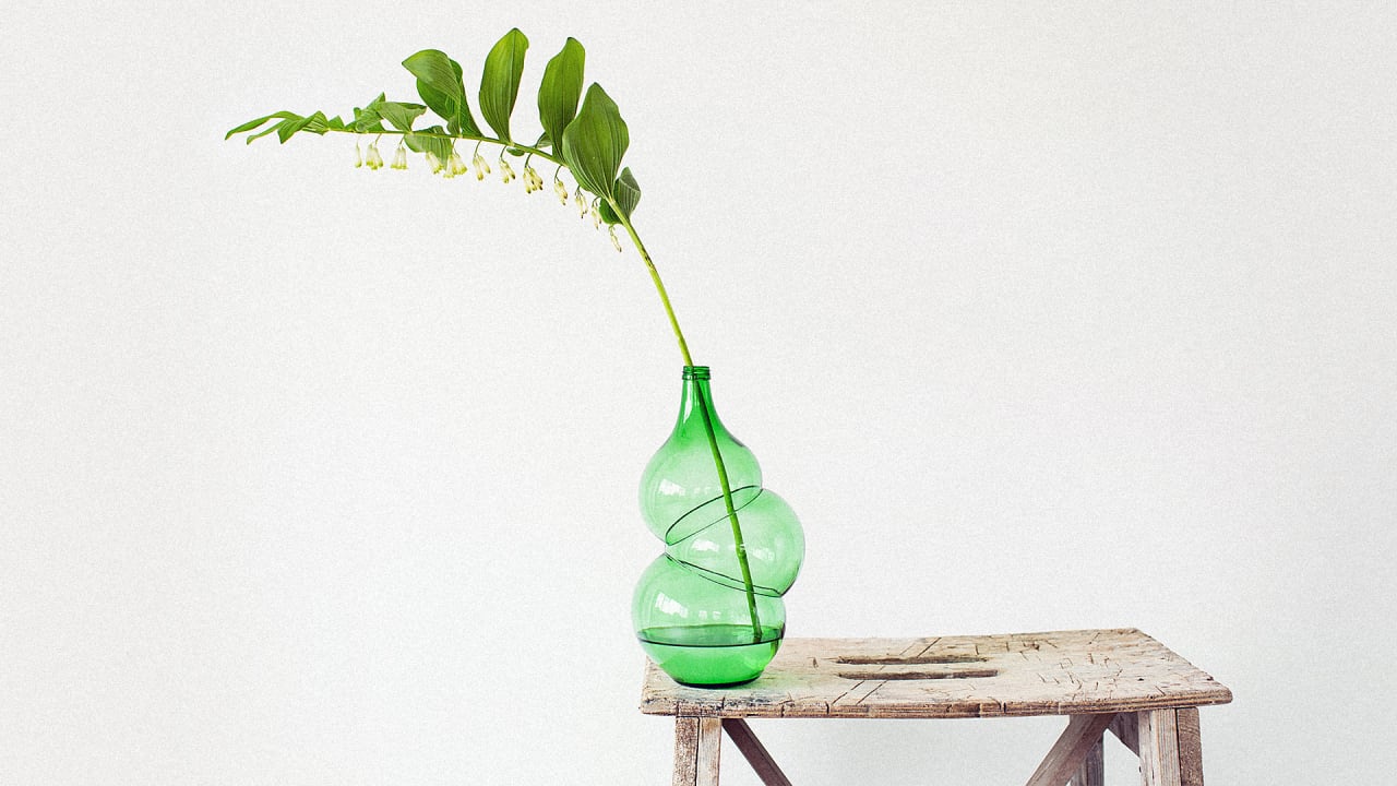 These Vases Are Made By Reblowing Used Wine Bottles