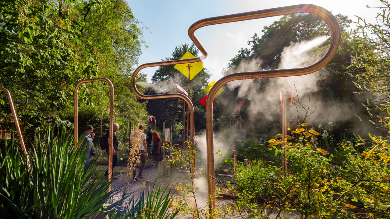 This stunning garden uses playground equipment and copper tubes to wat
