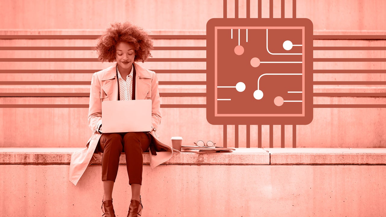 A professional working alongside AI tools on a laptop, symbolizing human-machine collaboration in the modern workplace