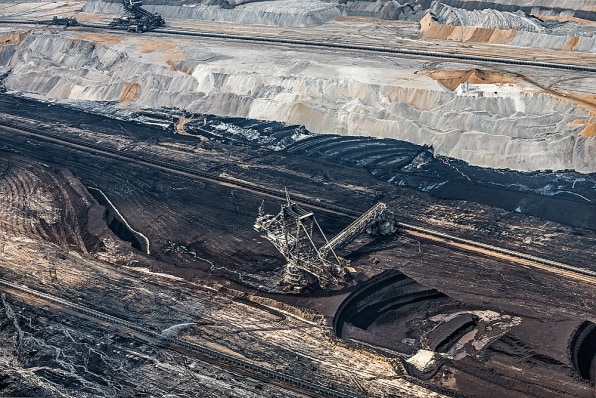 Premium Photo  Miners working deep inside a coal mine facility generative  ai