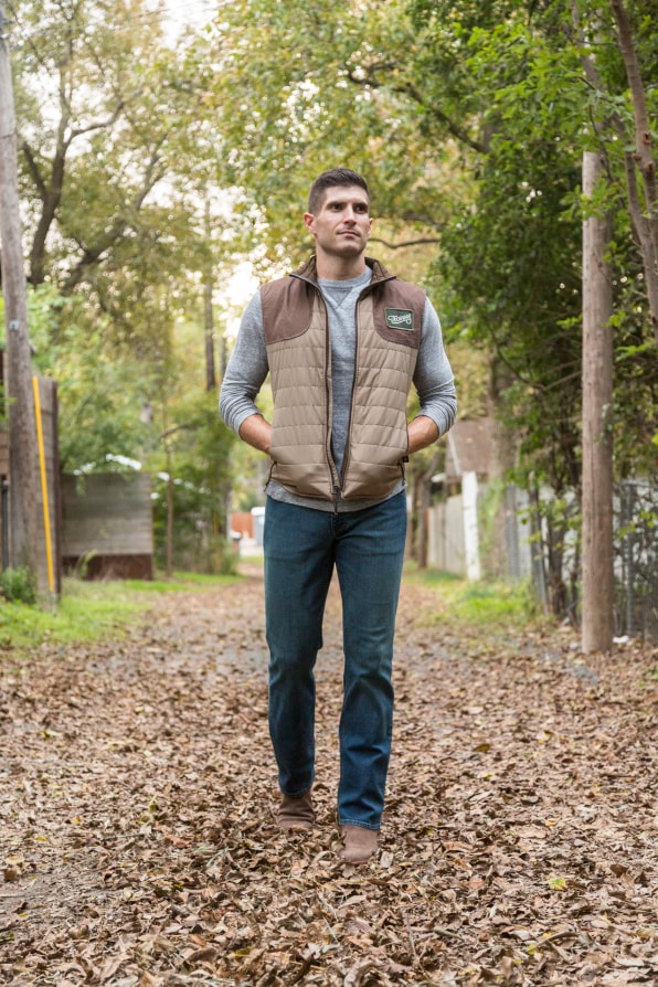 vest with jeans and cowboy boots